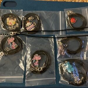Girls cord necklaces - selling 2 for $7 cats, gummy bears, rose, and cupcake